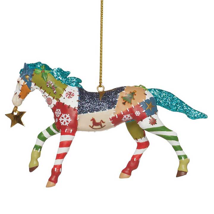 trail of painted ponies holiday patchwork horse ornament, crazy quilt patterned horse carrying a gold star in mouth - left side view with cord