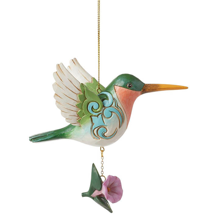 jim shore heartwood creek nature's meadow hummingbird ornament facing right hanging from gold cord with pink flower below