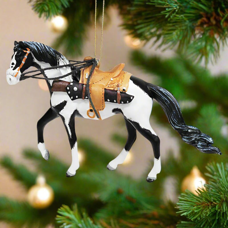 trail of painted ponies winchester ornament hanging in Christmas tree