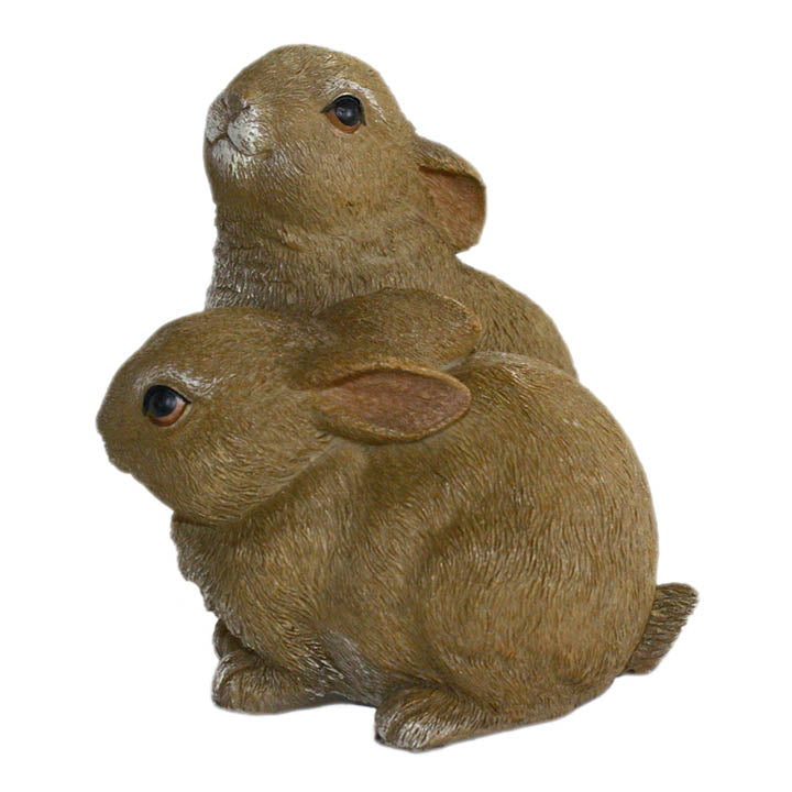 2 baby bunnies figurine with brown eyes one laying down one with head up left side view