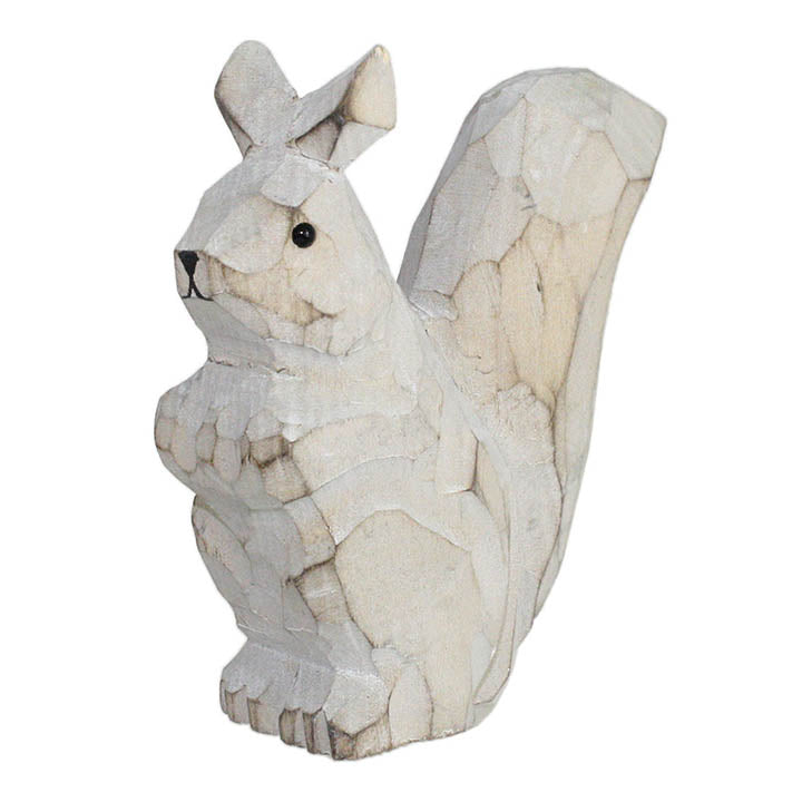 carved wood squirrel figurine facing left