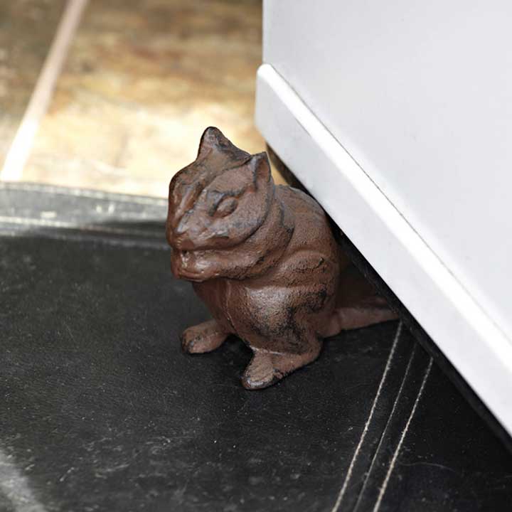 cast iron chipmunk door stop - left side detail, holding door