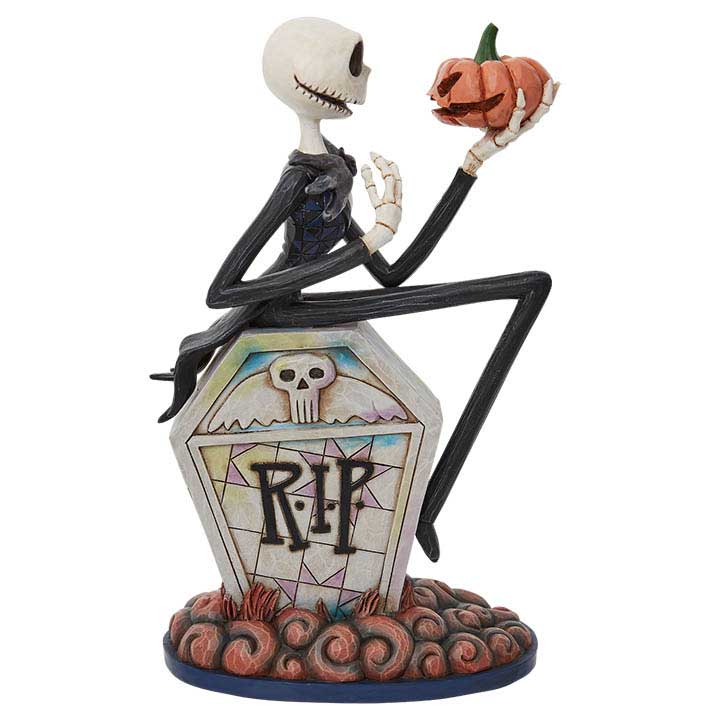 Enesco Jim Shore 6010866 Jack Skellington on Gravestone figurine, Nightmare Before Christmas, Halloween decor - front view of gravestone, side view of Jacks' face and pumpkin