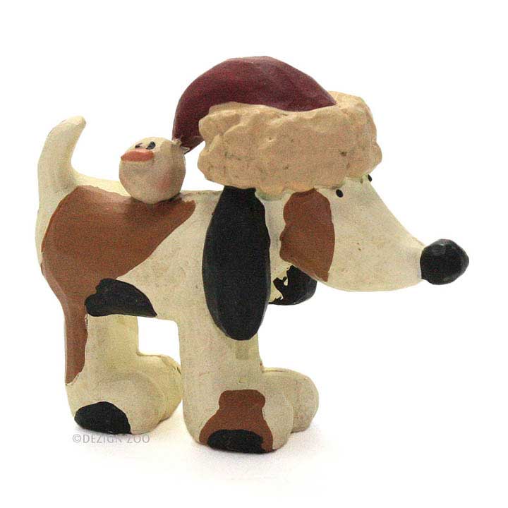 blossom bucket figurine, dog with brown and black spots wearing santa hat with duck pom charm