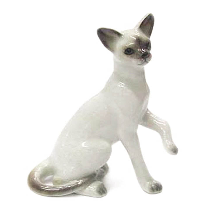 miniature porcelain siamese kitten facing forward figurine right side view