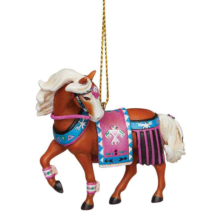 trail of painted ponies thunderbird ornament, palamino horse with blue and pink thunderbird art riding gear - left side view showing cord for hanging