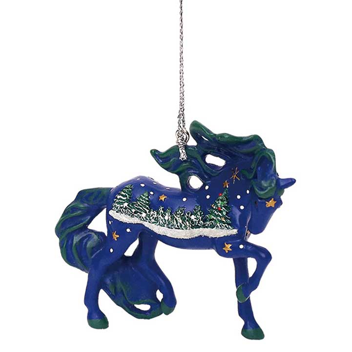trail of painted ponies white christimas ornament - blue horse with painted stars and christmas tree scene - right side view showing cord for hanging