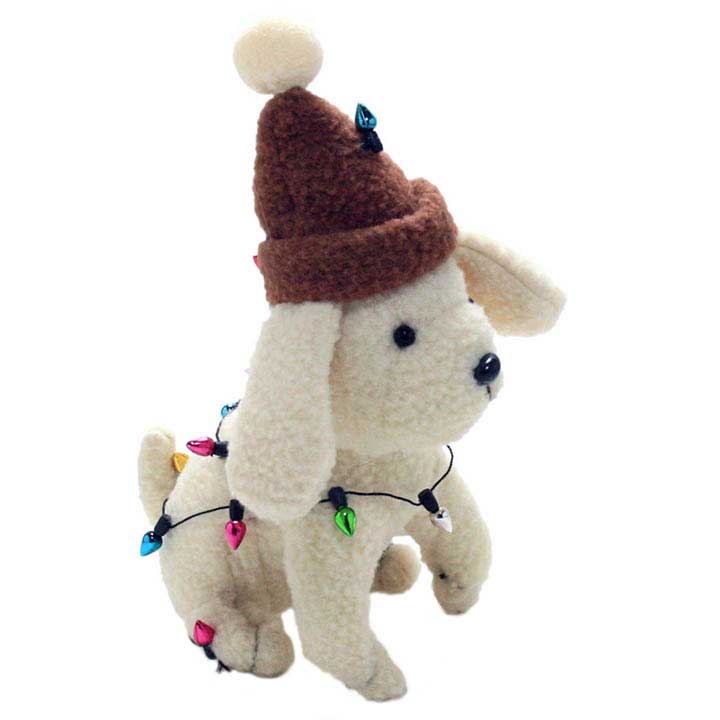 blossom bucket plush figurine of white dog wearing brown ski cap wrapped in christmas light decorations