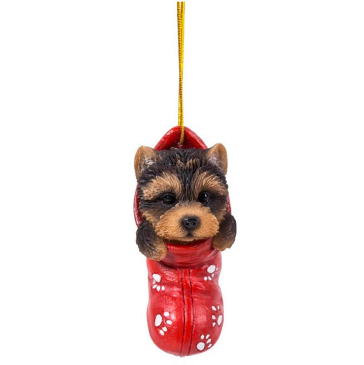full view of yorkshire terrier puppy in red stocking with white paw print designs christmas ornament hanging from gold colored cord